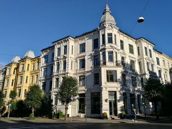 Low angle view of building against blue sky