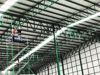 Low angle view of person standing in building