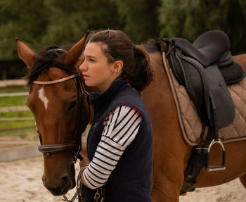  portrait of a young woman and her horse