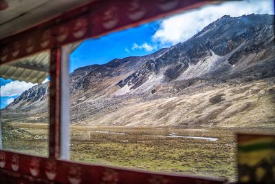 Mountains seen through window