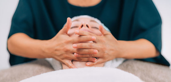 Close-up of woman getting massage therapy at spa