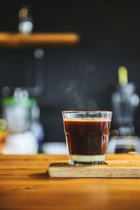 Close-up of coffee served on table at cafe