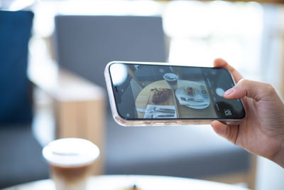 Close-up of woman using mobile phone