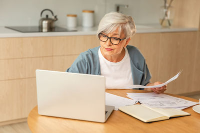 Portrait of young woman working at office