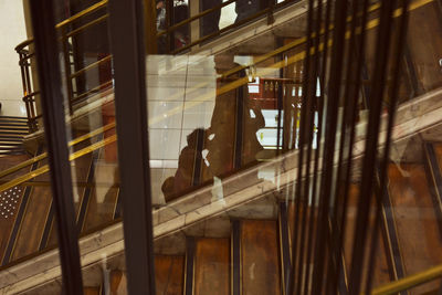 Reflection of building on glass window