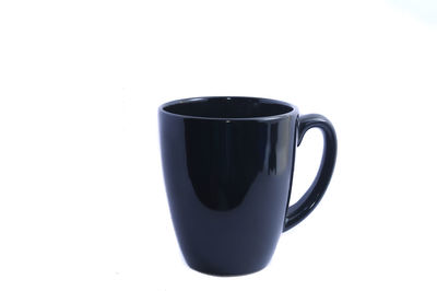 Close-up of coffee cup against white background