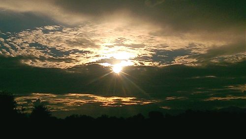 Sun shining through clouds