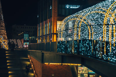 Illuminated buildings in city at night