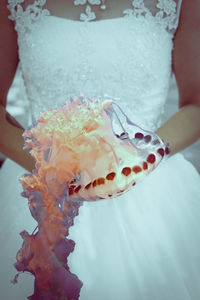 Close-up of woman holding ice cream cone