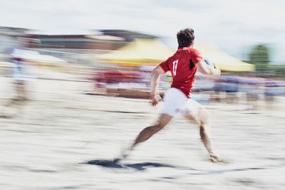 Full length of man running on road