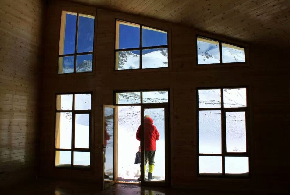 WOMAN STANDING ON WINDOW