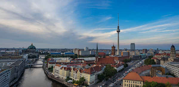 High angle view of cityscape against cloudy sky