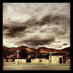 Cloudy sky over mountain range