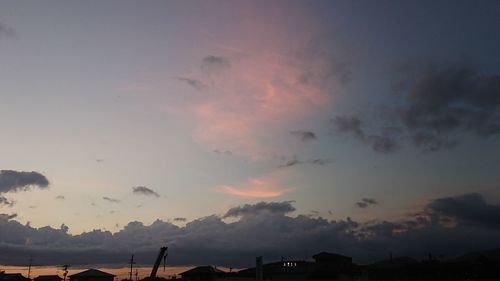 Low angle view of silhouette trees against sky