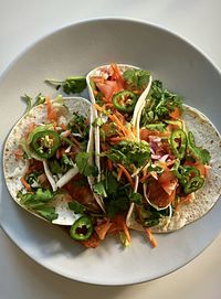 High angle view of fish tacos in plate on table