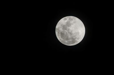 Scenic view of moon against dark sky