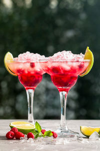 Close-up of red berries on glass