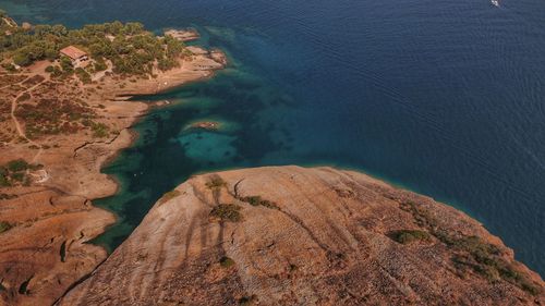 High angle view of mountain by sea