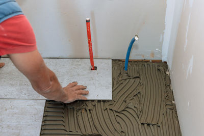 Midsection of man working on table