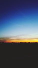 Scenic view of silhouette landscape against clear sky at sunset