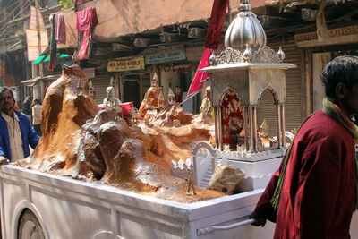 Sculptures and artwork on cart during procession