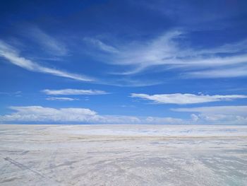 Scenic view of sea against blue sky