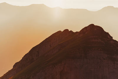 Scenic view of mountains against sky during sunset