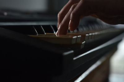 Fingers playing piano on the keys