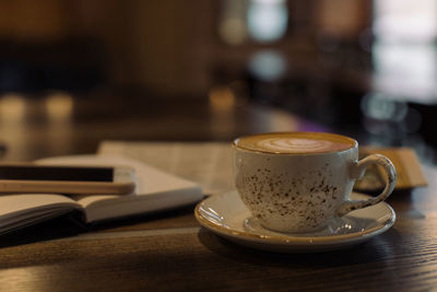 Close-up of coffee served on table