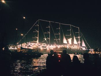 View of illuminated people at night