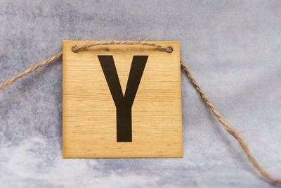 Close-up of letter y on wood on table