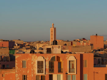 Residential buildings against clear sky