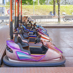 Bumper cars in row at amusement park