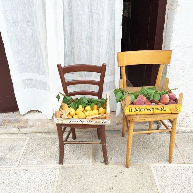 freshness, table, food and drink, yellow, potted plant, chair, healthy eating, food, day, arrangement, wood - material, flower, fruit, text, for sale, variation, indoors, retail, wall - building feature