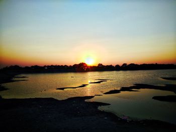 Scenic view of sea against sky during sunset