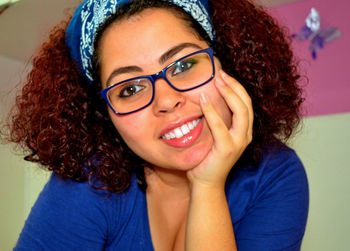 Portrait of happy curly redhead woman