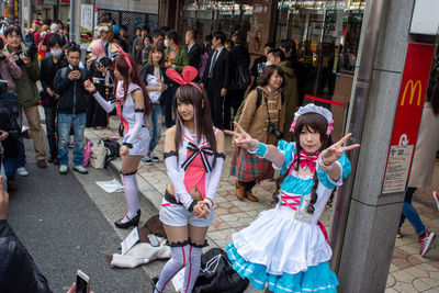 People standing on street in city