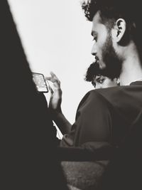 Portrait of young man looking away