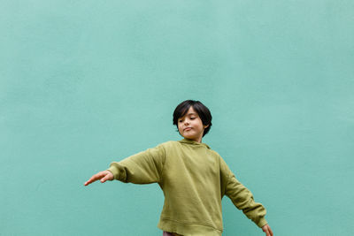 Dancing smiling girl with short dark hair