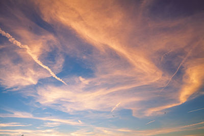 Low angle view of dramatic sky during sunset
