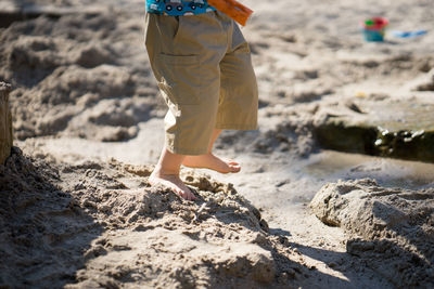 Barefoot child on beach