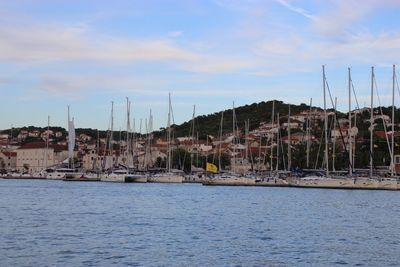 Panoramic view of sea and buildings against sky