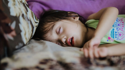 Girl sleeping on bed