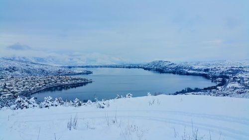 Scenic view of frozen lake against sky