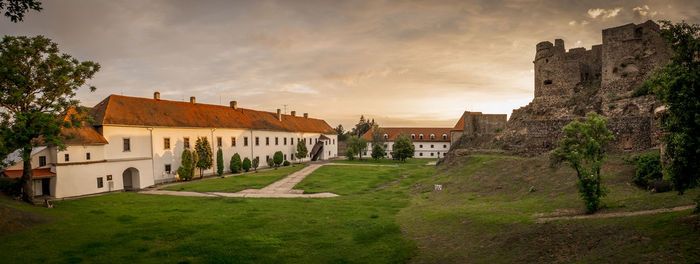 Buildings against sky during sunset