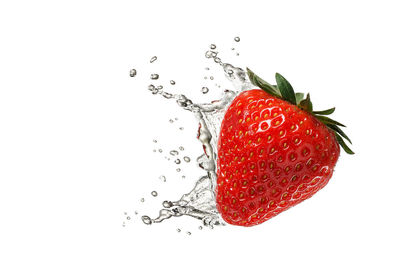 Close-up of strawberry against white background