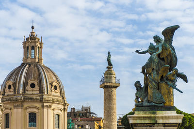 View of statue of building against cloudy sky