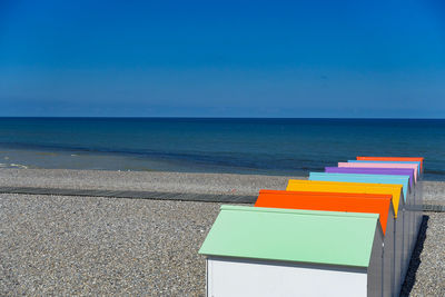 Scenic view of sea against blue sky