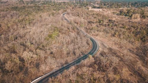 High angle view of tire tracks on road