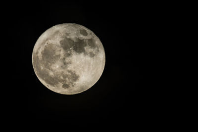 Full moon against clear sky at night